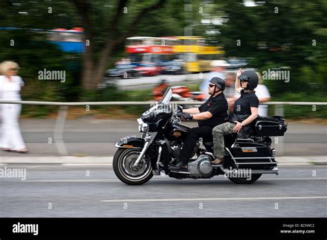 Couple riding harley davidson motorcycle hi-res stock photography and ...