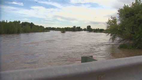 Levee breach keeps flood warning in place | 9news.com