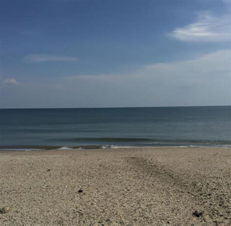 Premium Photo | General view of sunny beach with clouds sea and blue sky