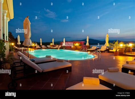 Swimming pool of luxury hotel at night Stock Photo - Alamy