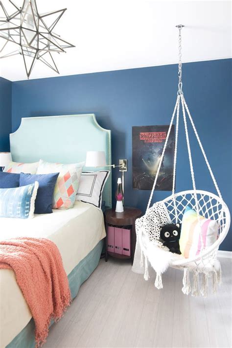 fun teenage girl bedroom with dark blue walls | stranger things poster | turquoise DIY headboard ...