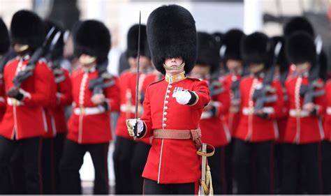 Why Royal Guards wear bearskin strap under lips instead of their chin | Royal | News | Express.co.uk