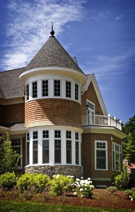 Shingle-style homes need towers, preferably with windows all the way around, to create places to ...