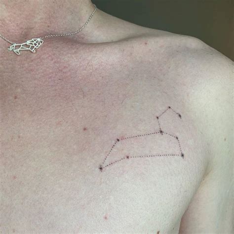 Minimalist leo constellation tattoo on the chest.