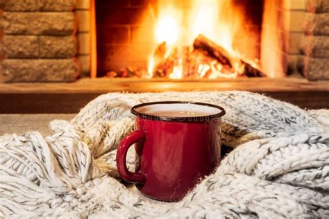 Cozy Scene Near Fireplace with Mug of Hot Drink, Cones, Candle, Wool ...