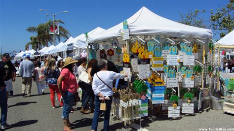 Strawberry Festival in Oxnard, California - People checking out one of the many stands | TouristBee