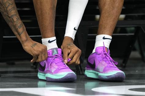 Memphis Grizzlies guard Ja Morant (12) ties his shoe before the game ...