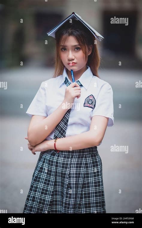 Ho Chi Minh City, Vietnam: portrait of beautiful Vietnamese girl in school uniform Stock Photo ...