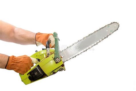 Chainsaw. An isolated gasoline chainsaw being held in a ready position ...