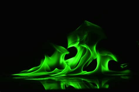 Premium Photo | Abstract Green fire flames on black background