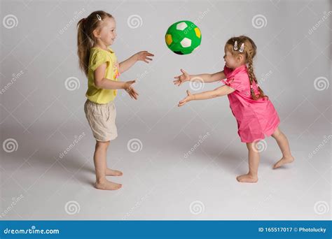 Ccheerful Kids Throwing and Catching Ball. Concept of Happiness and ...