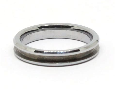 A pair of tungsten rings with Jarrah wood inlay by Wooden Ring Store