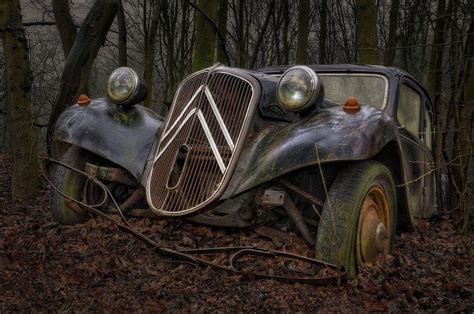 6 Haunting Photographs of Abandoned Vintage Cars Lying in a Forest ...