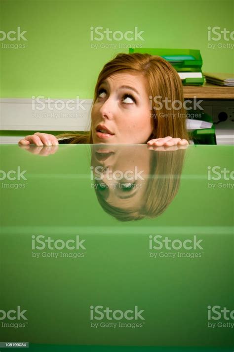 Scared Office Worker Hiding Under Desk Stock Photo - Download Image Now - Hiding, Office ...