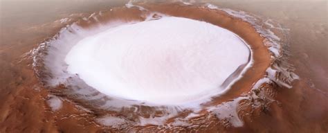 Stunning photos show huge crater on Mars absolutely brimming with water ...