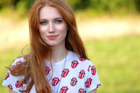 Radiant Redhead: A Joyful HD Wallpaper Featuring Blue Eyes and a Bright ...