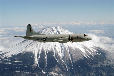 A P-3C Orion assigned to the Golden Eagles of Patrol Squadron Nine (VP-9) in full display with ...