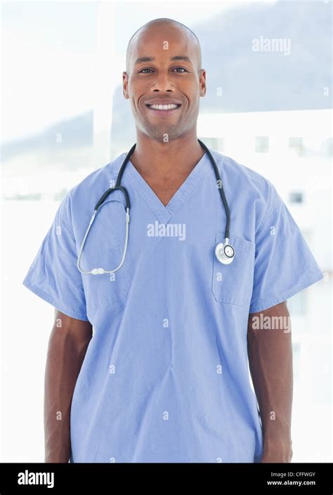 Smiling doctor standing Stock Photo - Alamy