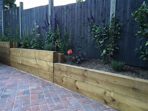 Finished retaining sleeper wall, steps, block paving driveway and ...