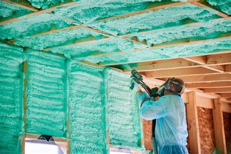 Worker Spraying Polyurethane Foam for Insulating Wooden Frame House. Stock Photo - Image of ...
