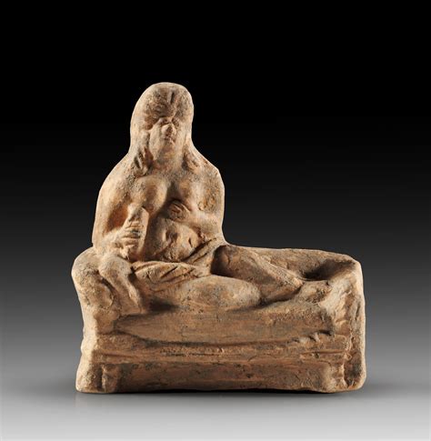 Roman hetaera leaning on a kline, 2nd-3rd century A.D. In her right hand she holds a alabastron ...