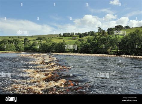 Turbulent River Swale rushing through iconic Swaledale scenery, Yorkshire, England Stock Photo ...