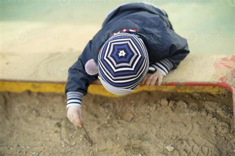 Child in sandbox. Preschooler on playground. 11141964 Stock Photo at ...