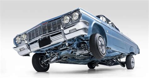 custom lowrider 1964 chevrolet impala convertible tilts and pumps over three wheels