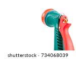 Image of Green plastic garden hose and orange nozzle | Freebie.Photography