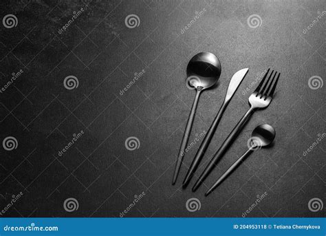Black Cutlery on a Concrete Dark Table. Dining Table Stock Photo - Image of arrangement ...