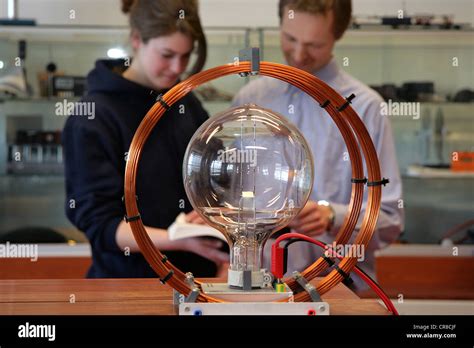 Researchers of physics doing a science experiment in the lab Stock ...