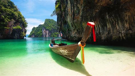 A boat through rocks - Andaman Sea Thailand Wallpaper Download 5120x2880