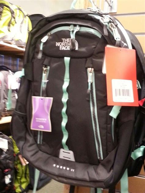 Black and Iight teal North Face backpack