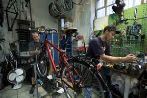 File:Munich - Two men working in a Bicycle repair shop - 5893.jpg ...