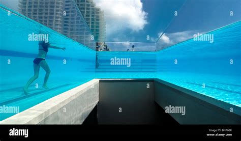 The glass walled swimming pool at the W Hotel in Miami allows an underwater view Stock Photo - Alamy