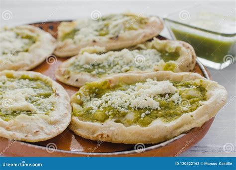 Mexican Sopes with Grated Cheese and Green Salsa, Mexican Food Spicy in Mexico Stock Photo ...