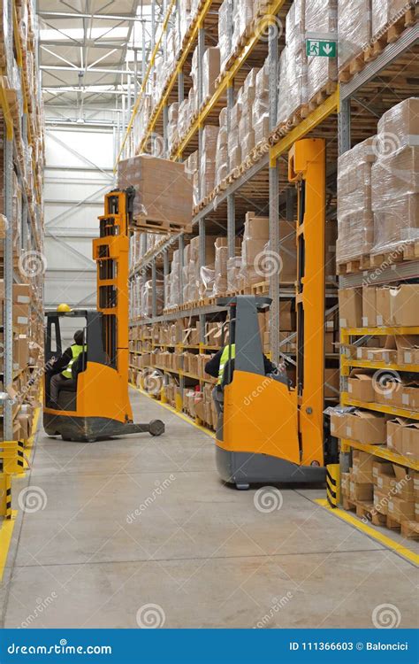 Two Forklifts Warehouse stock image. Image of driver - 111366603