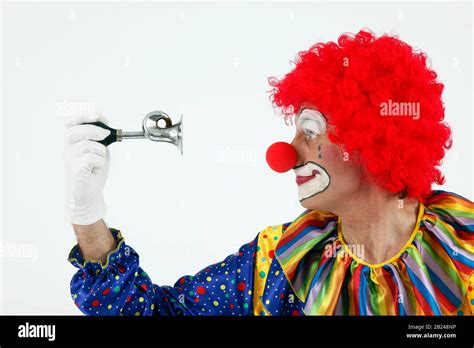 Clown honks his horn, Germany Stock Photo - Alamy