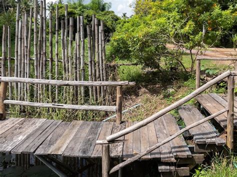 Premium Photo | The wooden bridge along the small pond