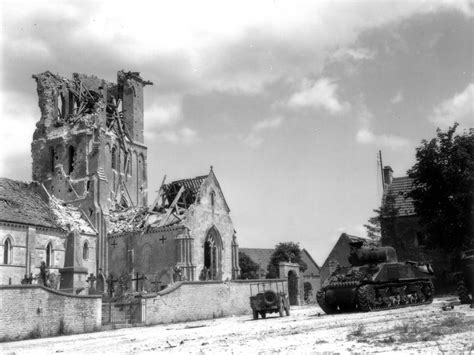 2 knocked out Sherman tanks outside Rots (Saint-Ouen) Church