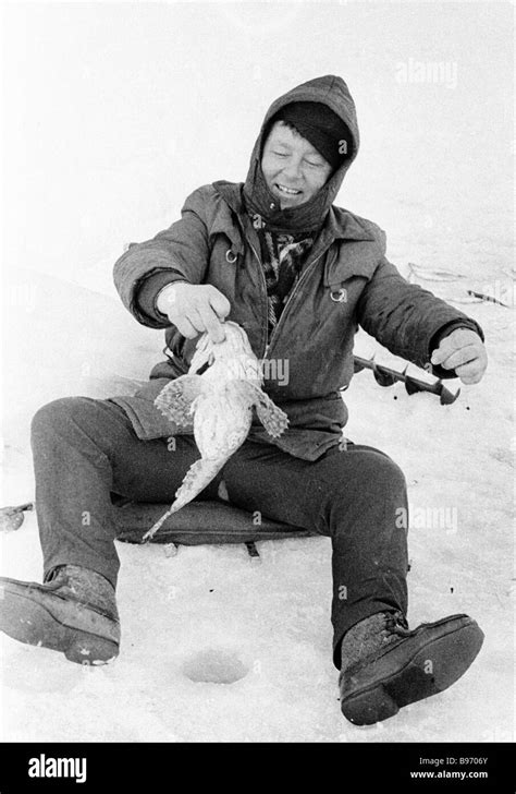 A fisherman with his catch Stock Photo - Alamy