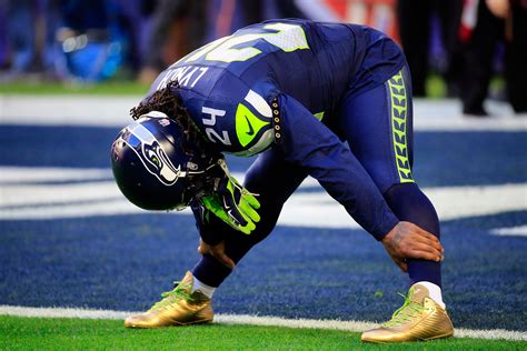 Marshawn Lynch Wore His Super Cool, Suspension-Threatening Gold Cleats ...