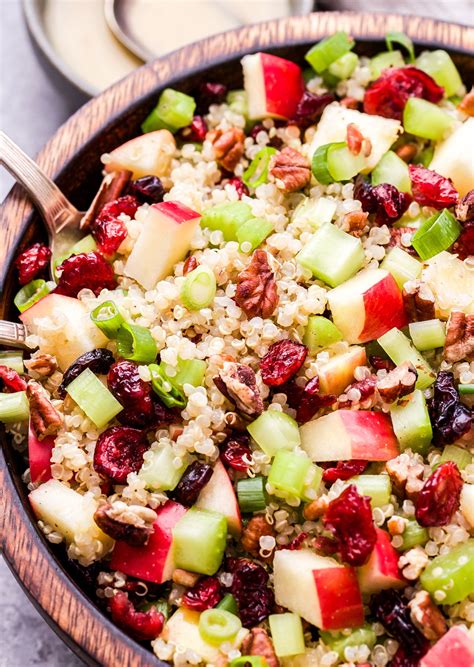 Cranberry Apple Quinoa Salad in wooden bowl with metal serving spoons. | Apple salad recipes ...