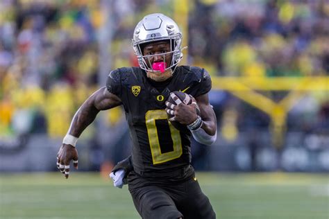 Bucky Irving tops 1,000 yards for 2nd straight season in Oregon ...