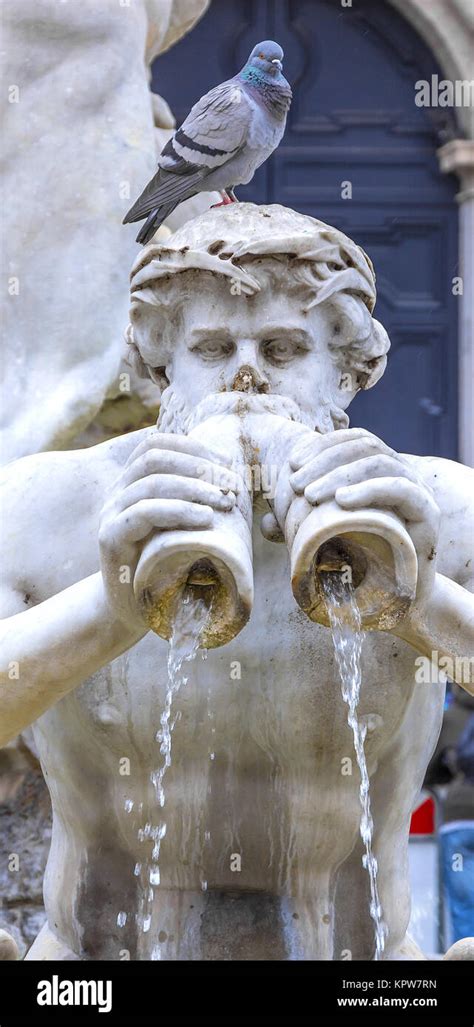 triton statue with pigeon Stock Photo - Alamy