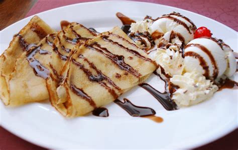 Dessert: Pancakes, Ice Cream and Chocolate Syrup Stock Photo - Image of delicious, food: 140002510