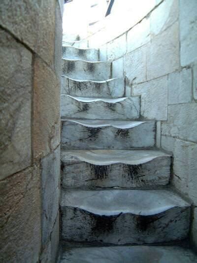 The worn marble steps at the Leaning Tower of Pisa. This is the result of 500 years of walking ...