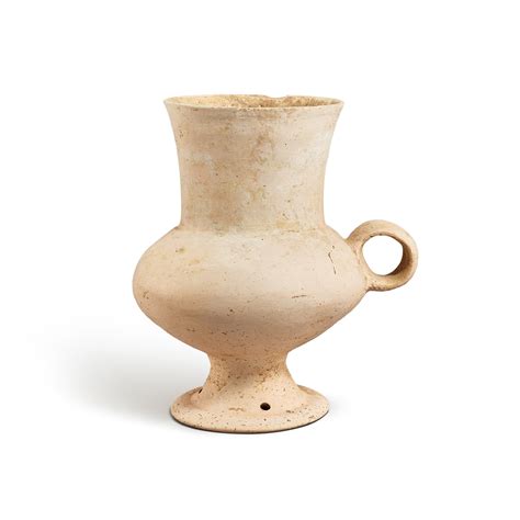 A white pottery goblet, Dawenkou culture, 4300-2400 B.C. 大汶口文化 白陶高腳盃 ...