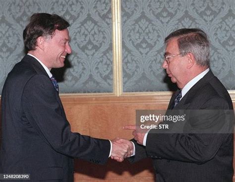 Russian Prime Minister Yevgeny Primakov points at Horst Koehler and ...