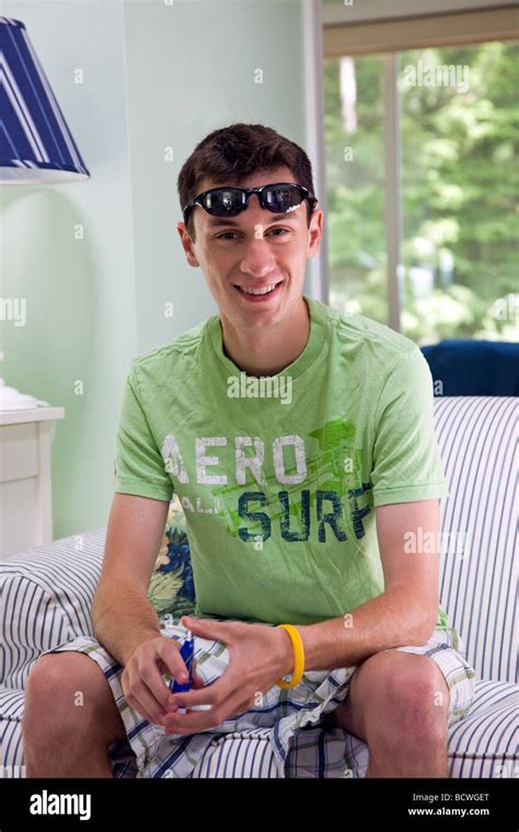 Portrait of 20 year old male in a vacation condominium in Wells Maine USA Stock Photo - Alamy